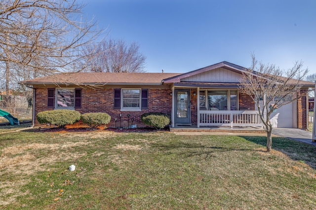 ranch-style house with an attached garage, covered porch, a front yard, and brick siding