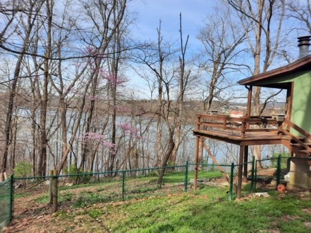 view of yard featuring fence and a wooden deck