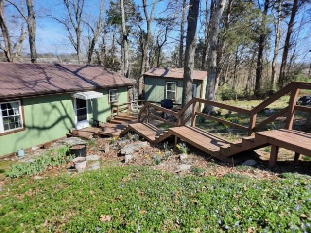 view of yard with a wooden deck