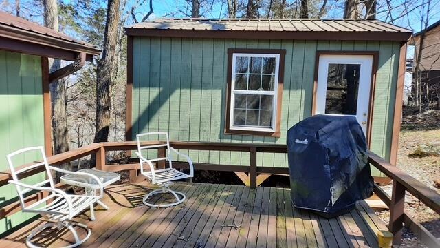 wooden deck featuring grilling area