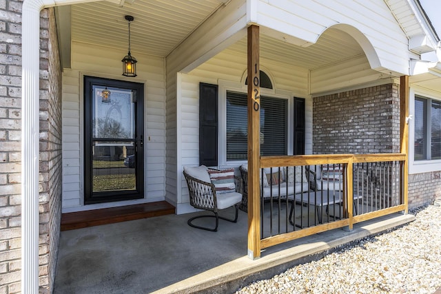 entrance to property featuring a porch