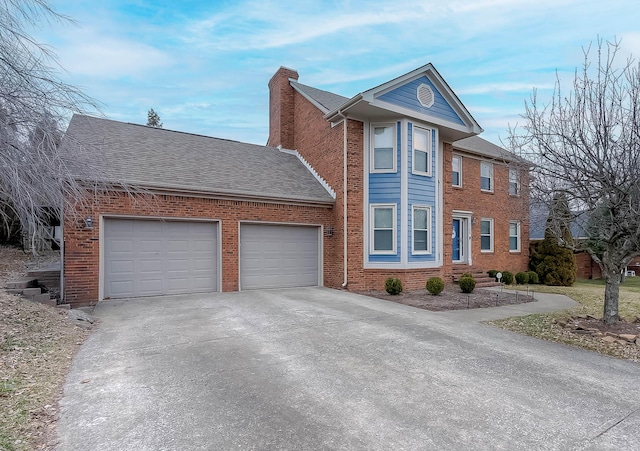 view of front of house with a garage, a chimney, concrete driveway, and brick siding