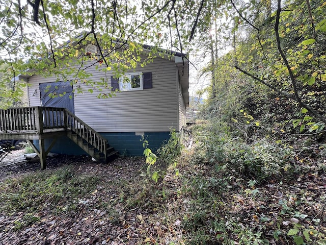 back of property featuring a wooden deck