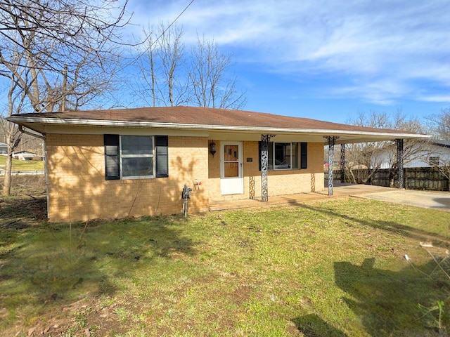 view of front of home featuring a front lawn and a carport