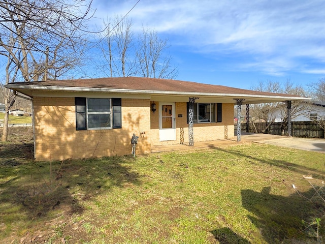 view of front of house featuring a front lawn and a carport