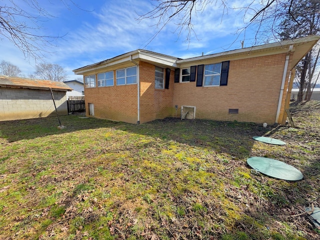 view of home's exterior featuring a lawn