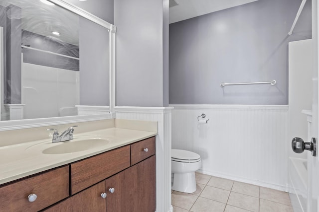 full bathroom with tile patterned floors, toilet, vanity, and bathtub / shower combination