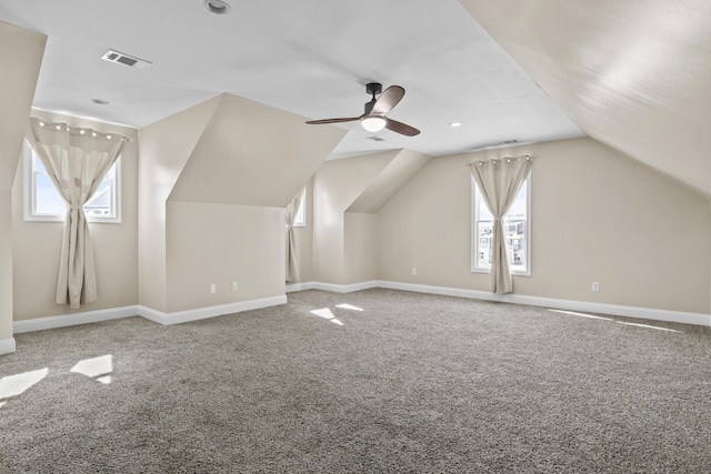 additional living space featuring ceiling fan, carpet flooring, and vaulted ceiling