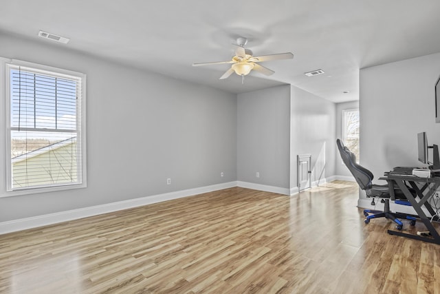 office featuring light wood-type flooring and ceiling fan