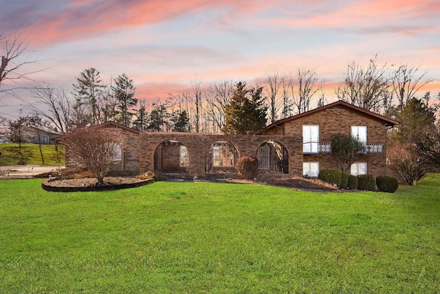 view of front of home with a yard