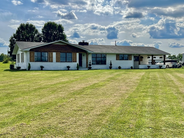 ranch-style home featuring central AC unit and a front lawn
