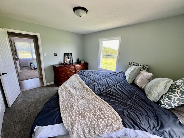 bedroom with carpet and baseboards