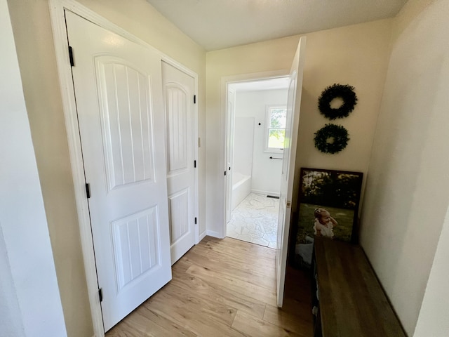 hallway featuring light wood-style floors