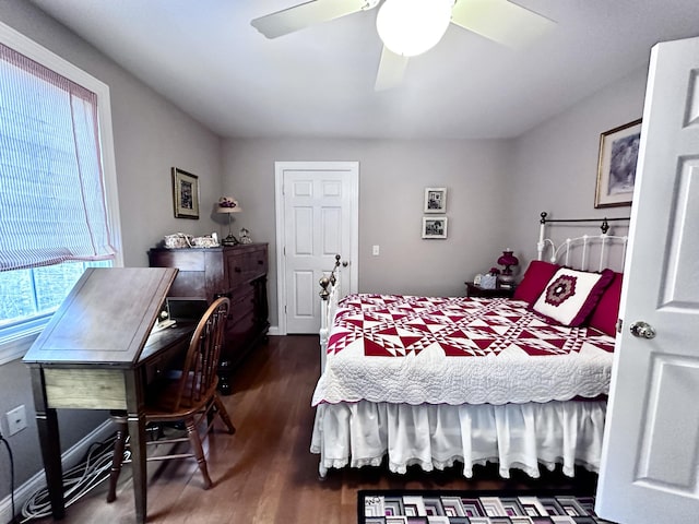 bedroom with dark wood-style floors and ceiling fan