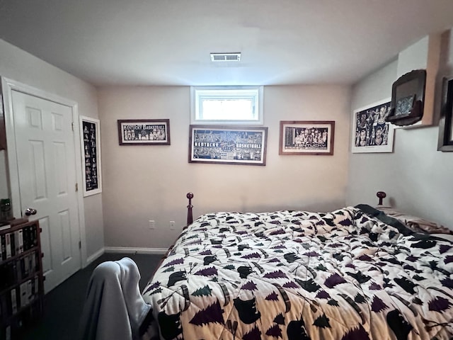 bedroom featuring visible vents and baseboards