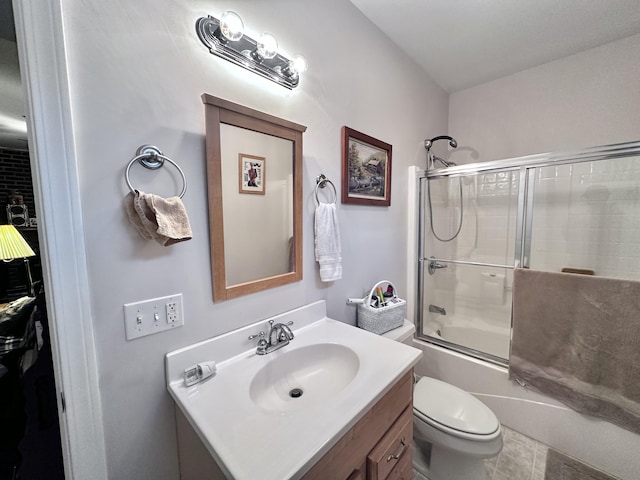 full bathroom with shower / bath combination with glass door, vanity, and toilet