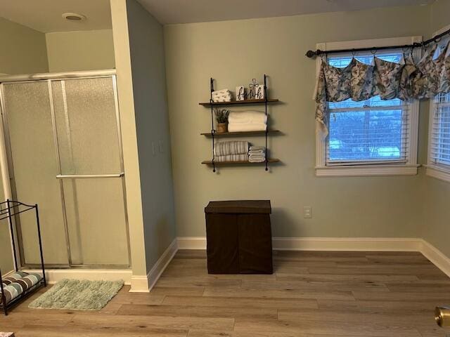 unfurnished dining area featuring hardwood / wood-style floors and a healthy amount of sunlight