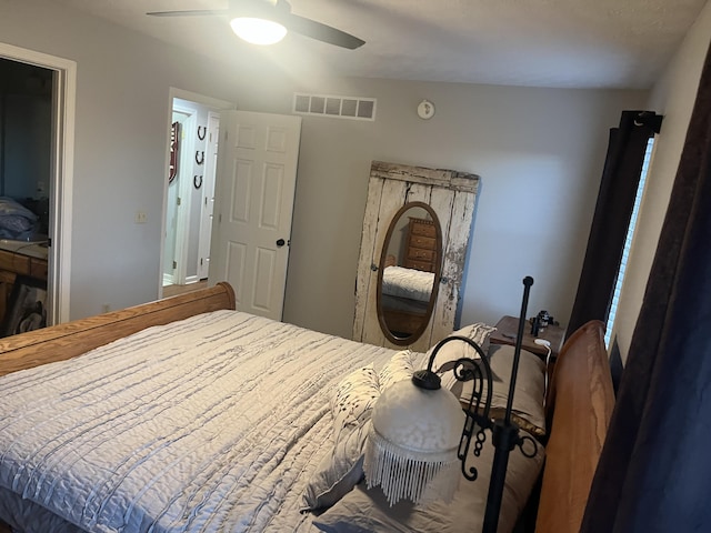 bedroom featuring visible vents and ceiling fan