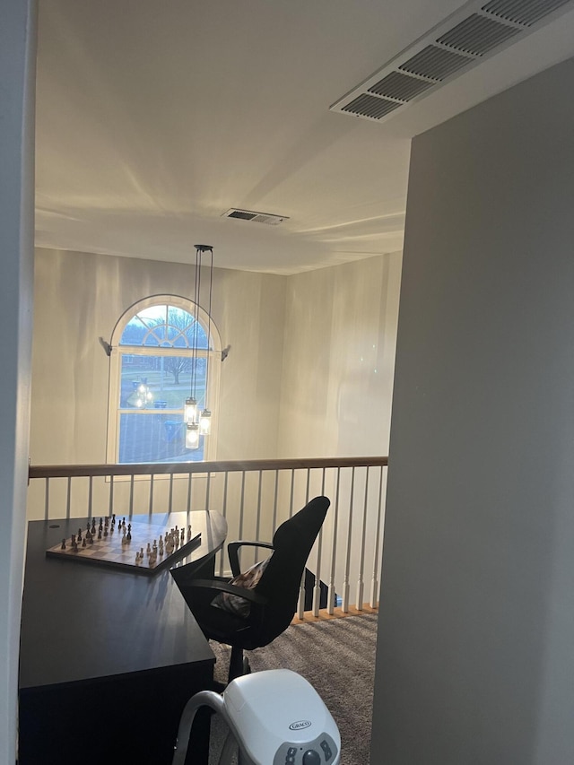 corridor featuring visible vents and carpet