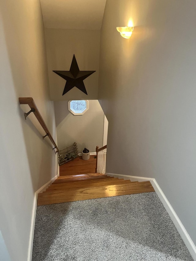 stairs with carpet and baseboards