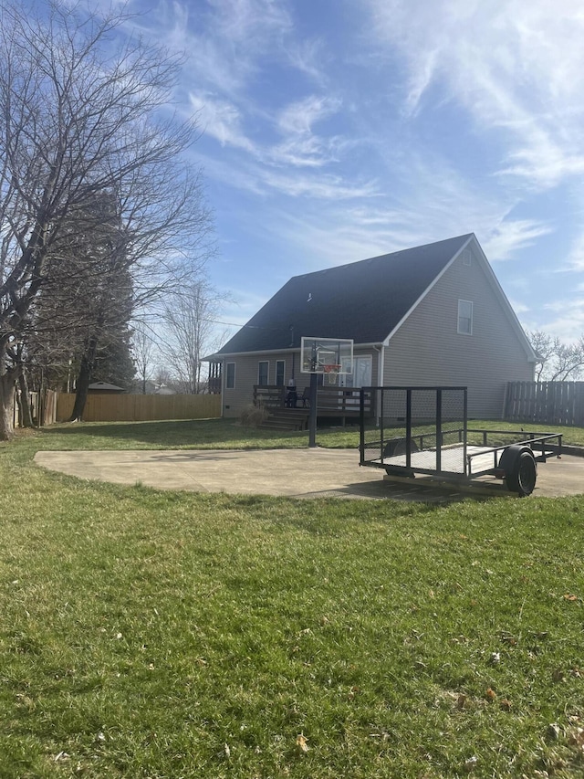 exterior space with a lawn and fence