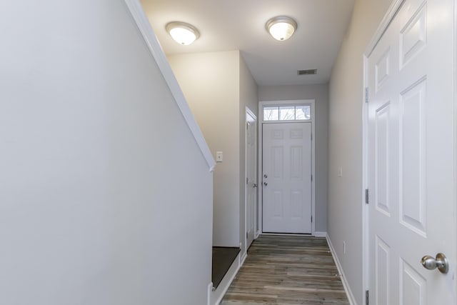 doorway featuring dark hardwood / wood-style floors