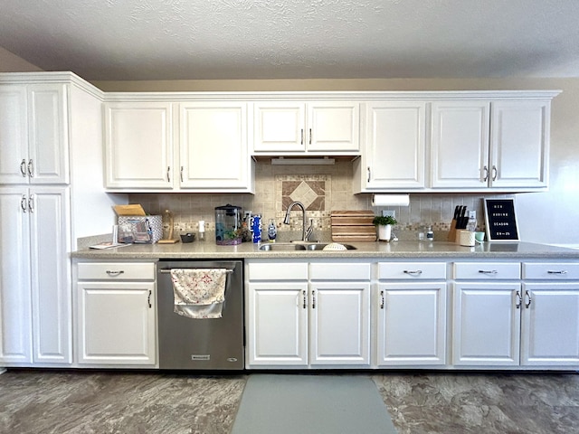 kitchen featuring sink, white cabinetry, tasteful backsplash, a textured ceiling, and stainless steel dishwasher