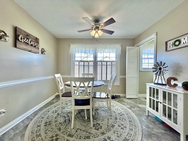 dining space featuring ceiling fan