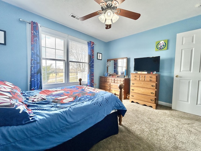 carpeted bedroom featuring ceiling fan