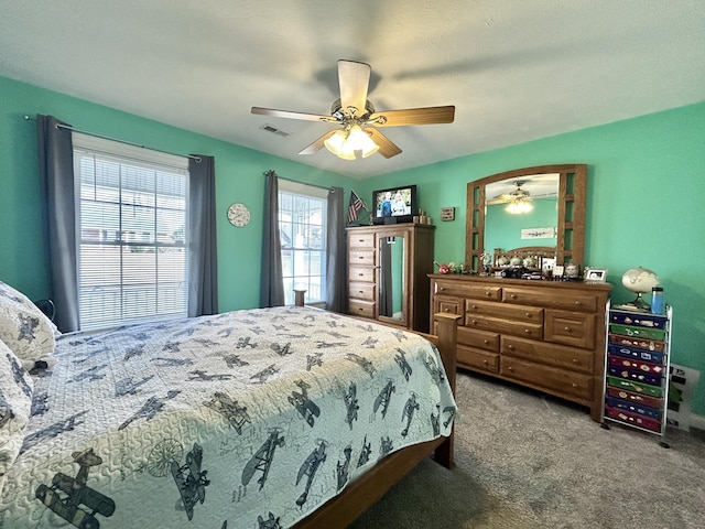 carpeted bedroom featuring ceiling fan