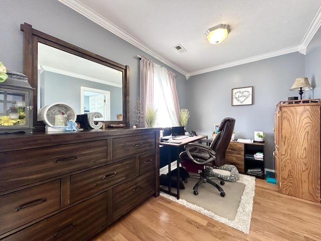 office with light hardwood / wood-style flooring and ornamental molding