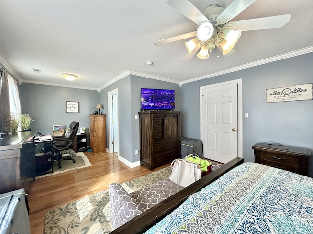 bedroom with crown molding, ceiling fan, and light wood-type flooring