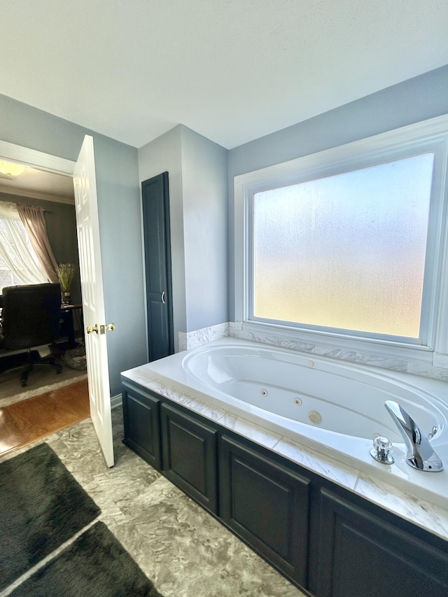 bathroom with a tub to relax in