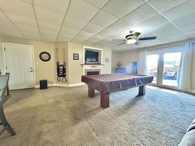 playroom featuring a paneled ceiling, a fireplace, carpet floors, pool table, and french doors