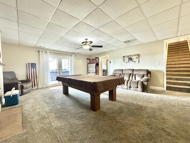 game room featuring french doors, pool table, carpet flooring, and a drop ceiling