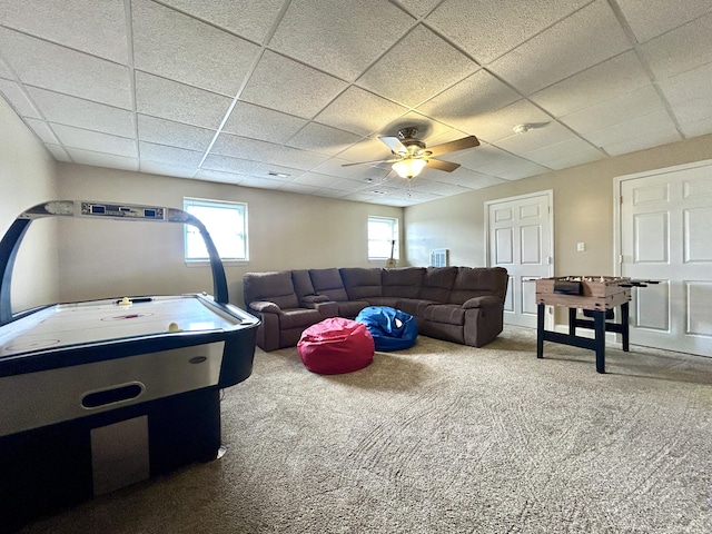 game room featuring a drop ceiling, carpet floors, and ceiling fan