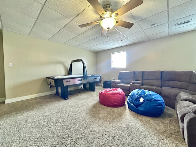 playroom featuring a paneled ceiling, ceiling fan, and carpet flooring