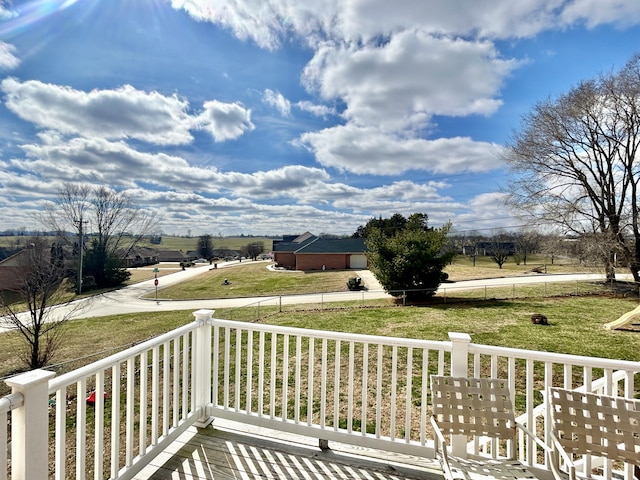 wooden terrace with a yard