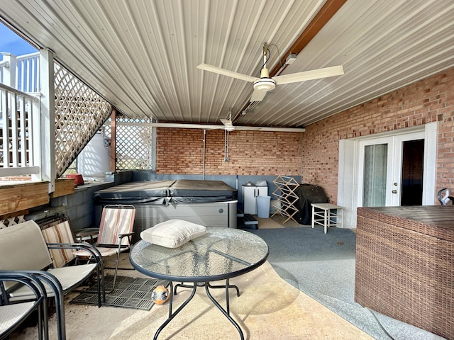 view of patio with ceiling fan, a grill, and a hot tub