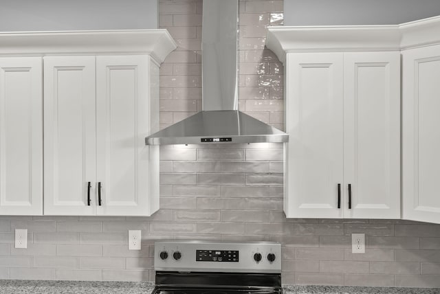204 Max Cavnes Rd, Danville, KY 40422 - interior details with white cabinetry, wall chimney range hood, tasteful backsplash, and stainless steel range with electric cooktop