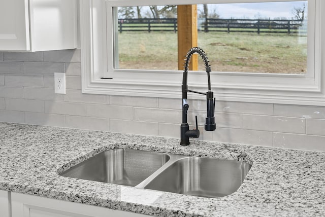 204 Max Cavnes Rd, Danville, KY 40422 - interior details with tasteful backsplash, white cabinetry, and a sink