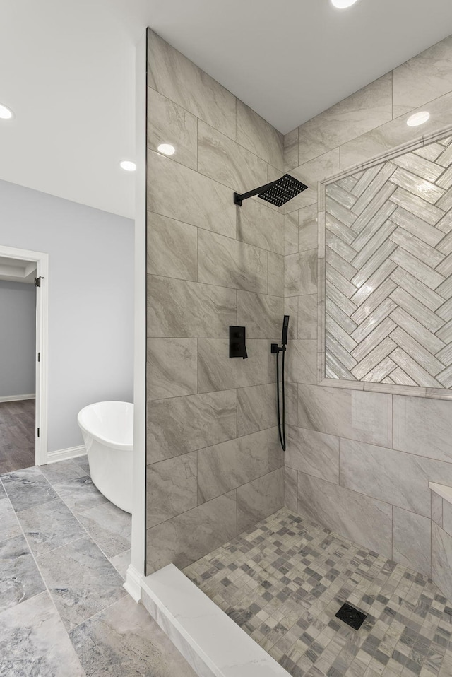 204 Max Cavnes Rd, Danville, KY 40422 - full bath featuring a soaking tub, baseboards, and tiled shower