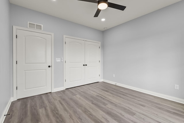 204 Max Cavnes Rd, Danville, KY 40422 - unfurnished bedroom featuring wood finished floors, visible vents, a closet, and baseboards