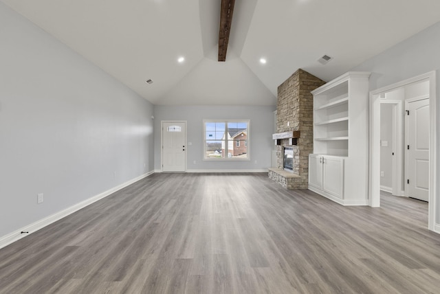 204 Max Cavnes Rd, Danville, KY 40422 - unfurnished living room with beam ceiling, high vaulted ceiling, wood finished floors, a fireplace, and baseboards