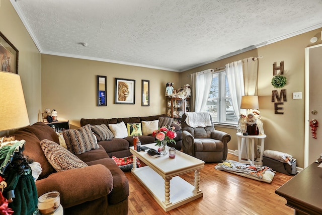 living room with a textured ceiling, ornamental molding, and wood finished floors