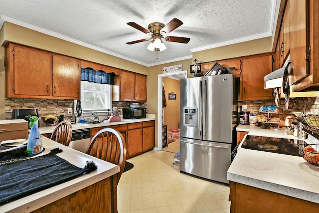 kitchen featuring stainless steel appliances, brown cabinetry, light countertops, and under cabinet range hood