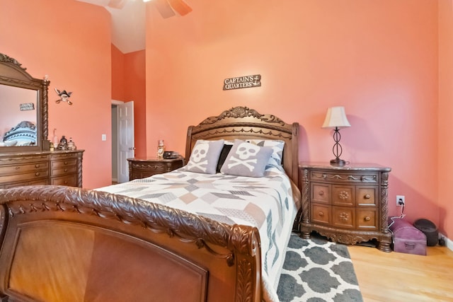 bedroom with ceiling fan and hardwood / wood-style floors