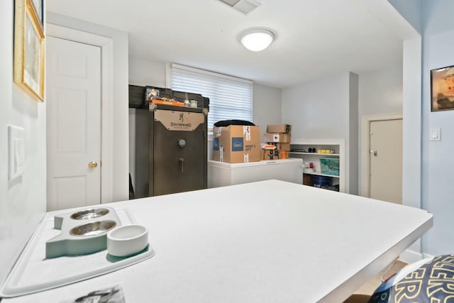 bedroom featuring kitchen peninsula