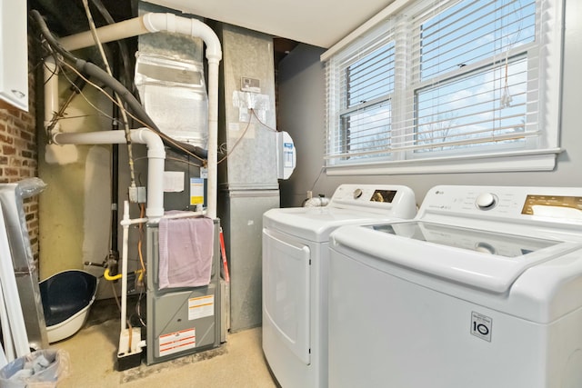 washroom featuring washer and dryer