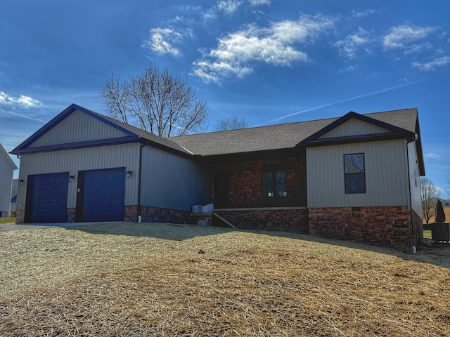 view of front of property with a garage and a front lawn